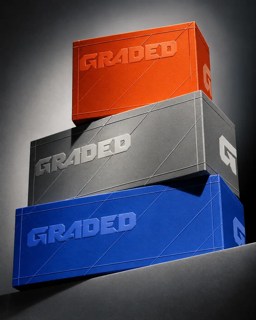 Stacked Graded shipping boxes in orange, silver and blue